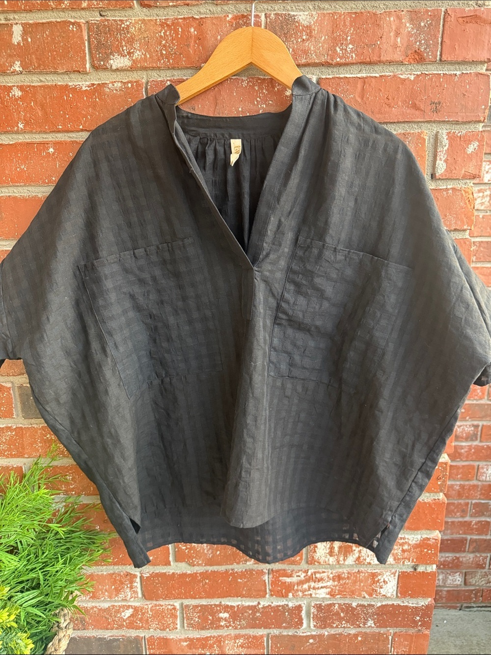 Two brand and made in the USA Women’s sheer black oversized short sleeve top.